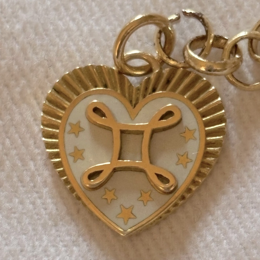 FOUNDREA TRUE LOVE PETITE MEDALLION. 18k YG & WHITE CHAMPLEVE